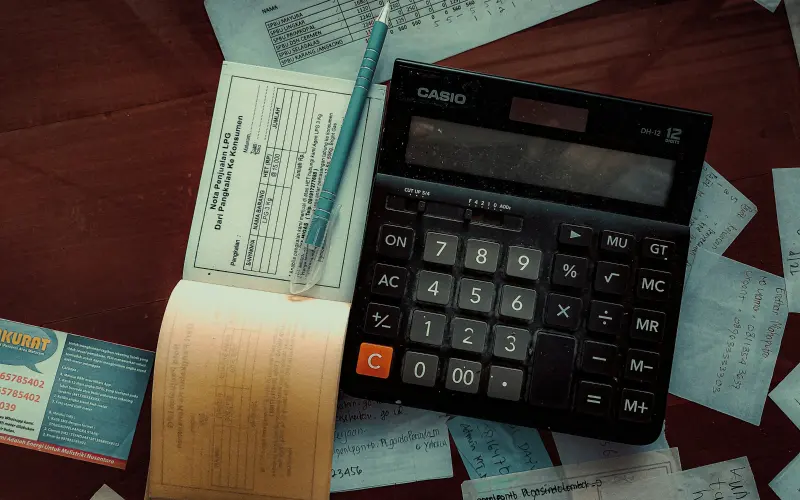 Calculator on receipts and account papers
