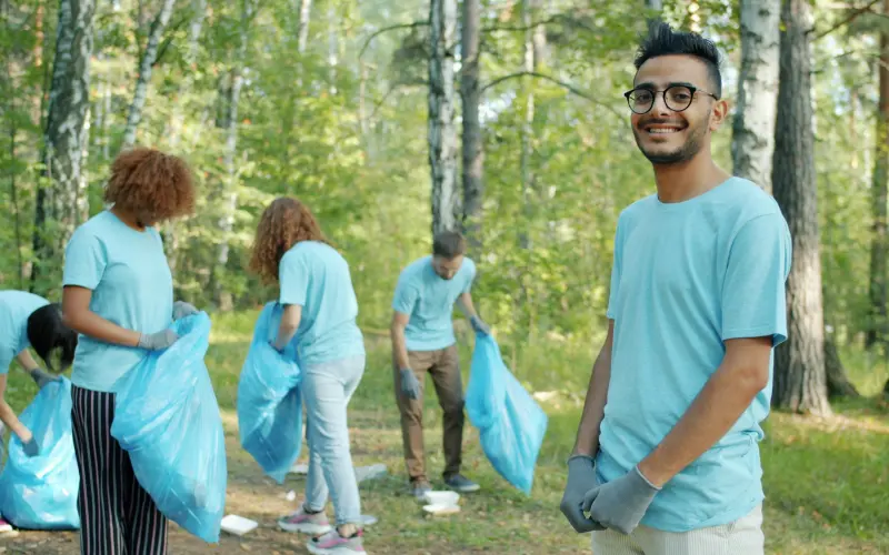Volunteers cleaning up a park together