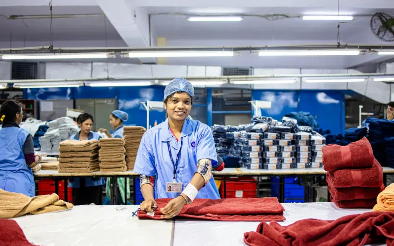 Workers at their stations in a garment factory