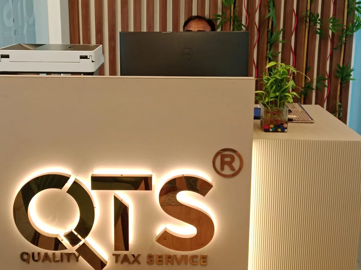 Lit QTS logo on the reception desk