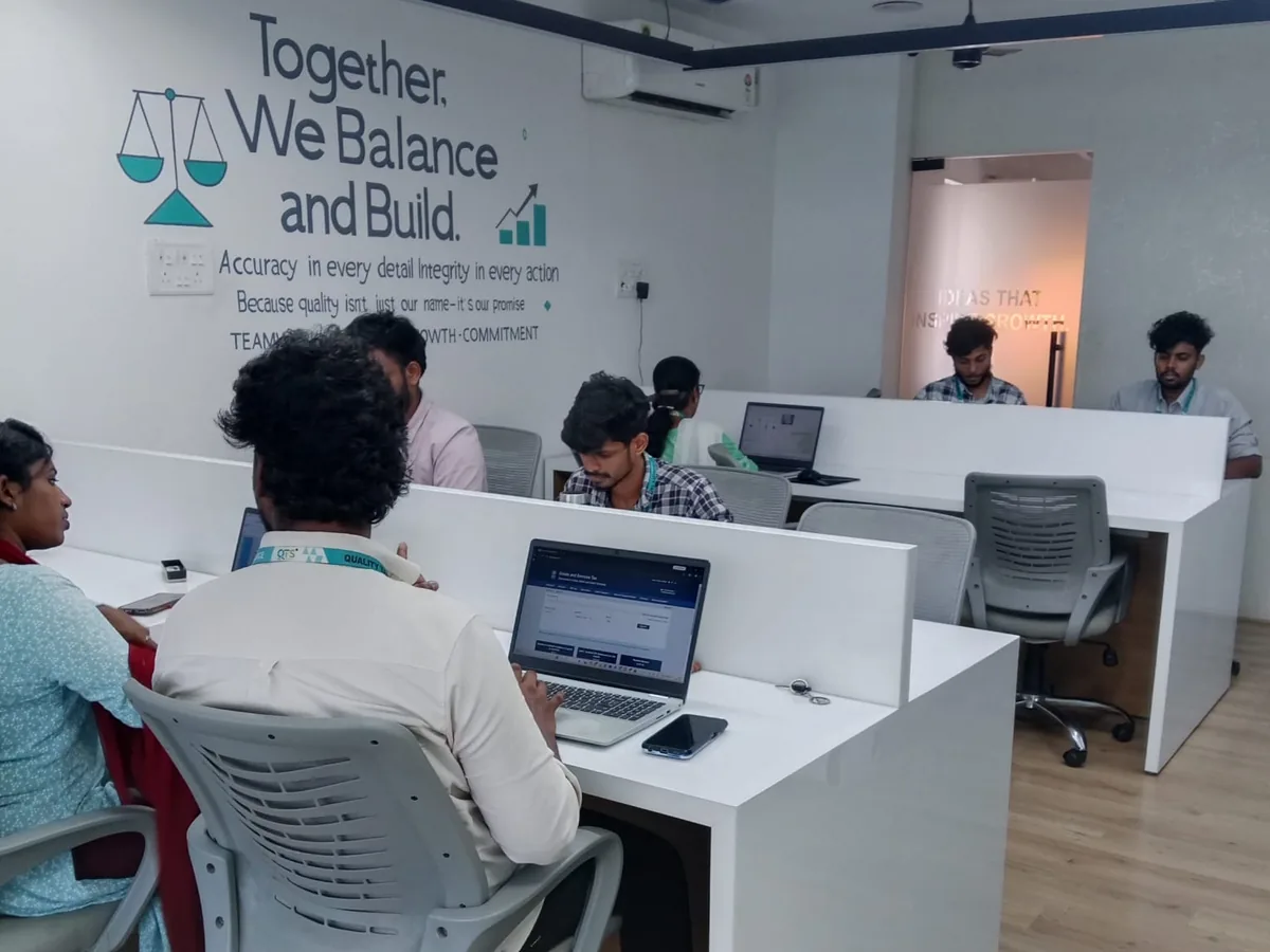 QTS team members at work in the open office