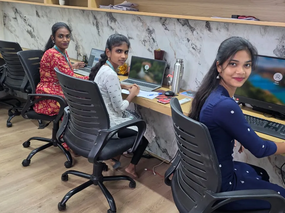 QTS team members at their workstations