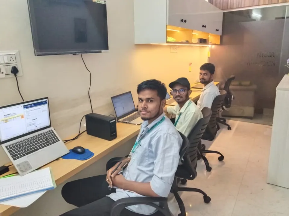 QTS team members working at their desks